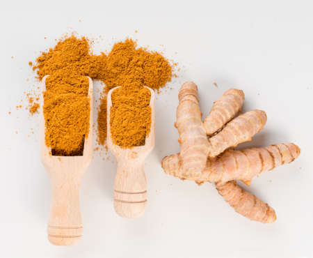Mixture of Indian Spices and Herbs Powders with Cumin, Curry, Curcuma and Chilli Pepper. Turmeric Root and Orange Seasoning Powder Mix Top Viewの写真素材