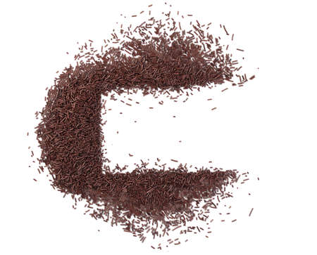 Chocolate sprinkles isolated on white background top view. Sweet brown glaze decoration or chocolate vermicelliの写真素材