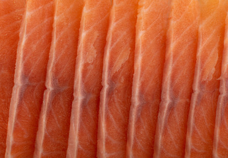 Macro Shot of Thin Slices of Raw Frozen Salmon Fillet Texture Background. Pieces of Fresh Red Fish...