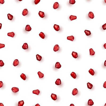 Scattered pomegranate seeds isolated on white background. Red punica granatum juicy grains top viewの写真素材