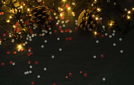 Christmas Warm Light on Natural Stone Background Top View with Copyspace. Beautiful Garland Lights Texture or New Year Pattern for Xmas Designの写真素材