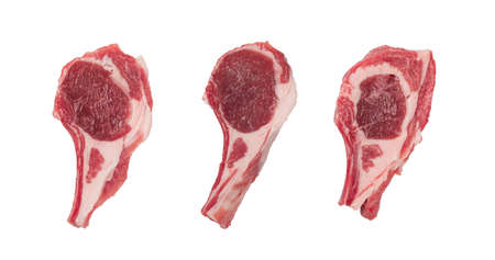 Raw lamb chops or mutton cuts isolated on white background with clipping path. Fresh sheep ribs cutlet on bone top view cut outの写真素材