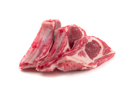 Raw lamb chops or mutton cuts isolated on white background. Fresh sheep ribs cutlet on bone cut out closeupの写真素材