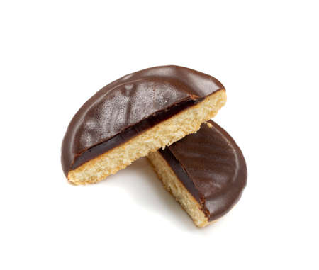 Jaffa cake or biscuit cookie filled with natural jam isolated. Round chocolate covered cookies with fruit marmalade or jellyの写真素材