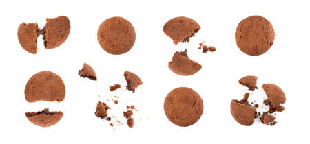 Crumbled chocolate butter cookie with chocolate filling isolated on white background. Brown round soft biscuits or broken sweet cocoa buns closeupの写真素材