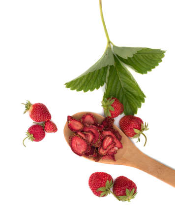 Group of home cooked dehydrated dry strawberries isolated on white background top view. Dried homemade sliced organic strawberry berries close upの写真素材