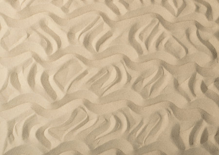 Light beige sea sand texture pattern, sandy beach textured background top view with copy space