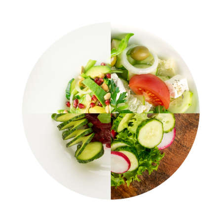 Set of four vegetables salads with fresh greens on white restaurant plate top view isolated. Simple green rustic salat collage with sliced radishes, cucumbers, tomatoes, beets, escarole and lettuceの写真素材