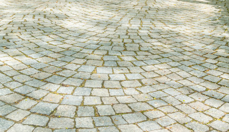 Grey Old Pavement Top View or Granite Cobblestone Road. Ancient Brick Cobblestoned Floor or Granite...