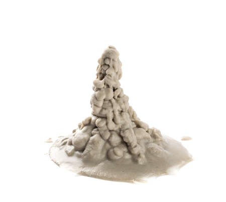 Heap of wet sea sand side view. Dripping sandy beach textured pile isolated on white backgroundの写真素材