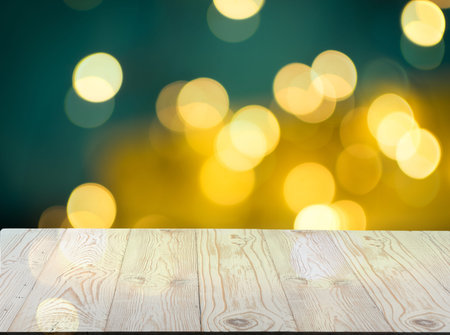 Wooden Table Mock Up with Garland Bokeh Circles. Blurred Garland with Old Wood Desk Christmas...