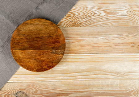 Empty plate on white wooden table top view with copy space. Rustical kitchen mock up with gray...