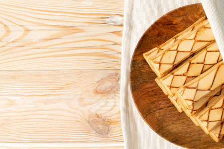 Sfogliatine glassate Italian puff pastry. Glazed puff pastries biscuits. One of the types of phyllo, crispy sweet bakery with icing sugar top view with copy spaceの写真素材