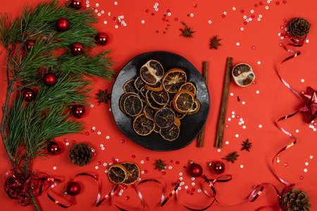 Dried slices of orange and blood orange on Christmas table background. Dry lemon, tangerine and sicilian orange top viewの写真素材
