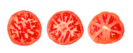 Sliced tomatoes isolated top view and flat lay. Tomato cross section on white background, pizza and salad ingredientsの写真素材