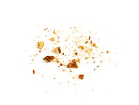 Crumbled chocolate biscuits pieces. Broken butter cookies bites with chocolate coating, soft biscuit crumbs isolated on white background top viewの写真素材