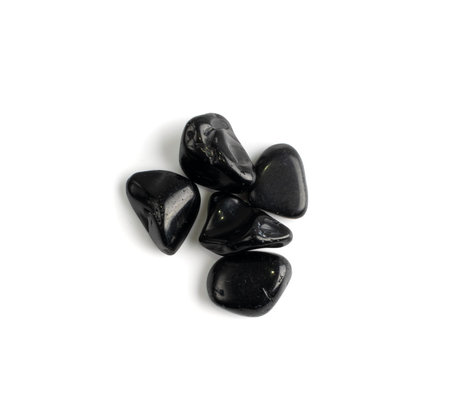 Black onyx pebbles isolated. Polished hematite gem stones, black marble pebble set, glossy gemstones...
