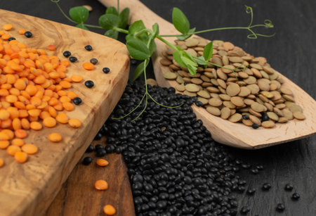 Brown, orange, black lentils and dry yellow peas. Legumes grains mix, dal, raw daal, dhal, masoor...