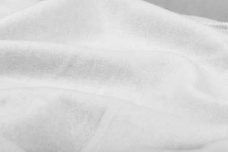 Soft gray cotton, elastane and polyester fabric texture background. Warm cozy clothing for home and gym in a sporty styleの写真素材