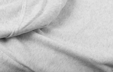 Soft gray cotton, elastane and polyester fabric texture background. Warm cozy clothing for home and gym in a sporty styleの写真素材