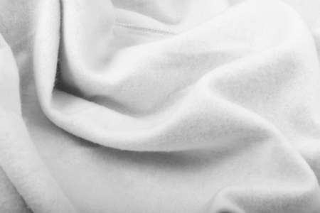 Soft gray cotton, elastane and polyester fabric texture background. Warm cozy clothing for home and gym in a sporty styleの写真素材