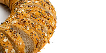 Homemade Sourdough Bread Loaf Slices Isolated. Crusty Cereal Bread Pieces on White Background with Copy Spaceの写真素材