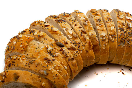 Homemade Sourdough Bread Loaf Slices Isolated. Crusty Cereal Bread Pieces on White Background