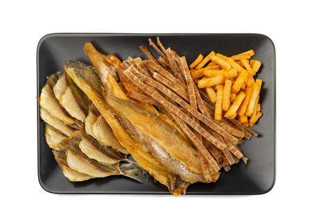 Dried fish sticks isolated. Dry salted seafood snack, hake stockfish, small pieces of dehydrated...
