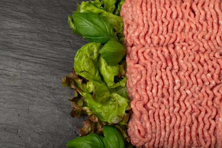 Turkey mince meat mockup. Ground fillet on black background with copy space, uncooked turkey...