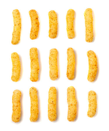 Corn sticks set isolated. Cheese puffs with spices, crunchy single snacks collection, salty corn sticks top viewの写真素材