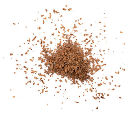 Graded chocolate isolated. Crushed chocolate shavings, crumbs pile, flakes heap, cocoa sprinkles for desserts decoration on white background top viewの写真素材