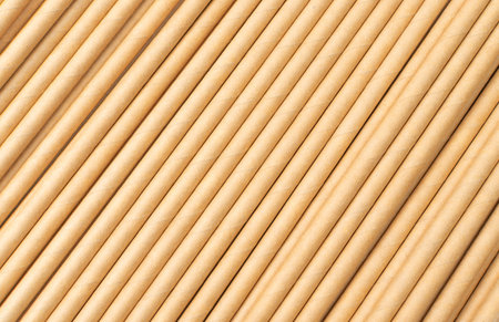 Paper drink straw texture background. Brown disposable drinking straws pattern, eco-friendly...