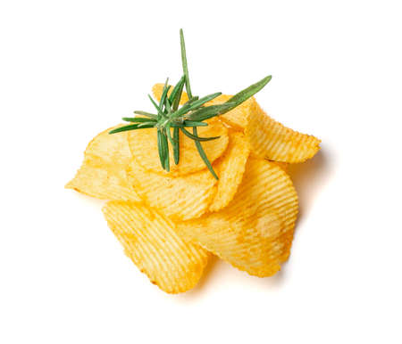 Potato chips pile isolated. Crispy corrugated potato snack heap with greens, fast food thin snacks group on white backgroundの写真素材