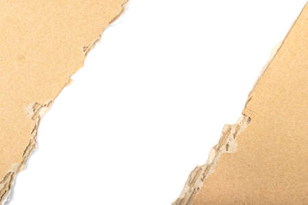Torn cardboard edge background. Carton torn with copy space, kraft paper frame top viewの写真素材