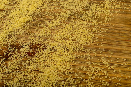 Couscous texture background top view. Dry cuscus, raw kuskus, uncooked cous cous or semolina...