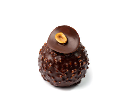 Round chocolate mousse cake isolated. French glazed nut dessert, luxury mousse confectionery with liquid hazelnuts souffle filling on white backgroundの写真素材