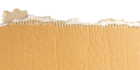 Torn cardboard edge background. Carton torn with copy space, kraft paper frame top viewの写真素材