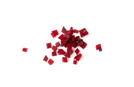 Beetroot cubes isolated. Finely diced red beet pile, small beet root pieces, chopped beetroot on...