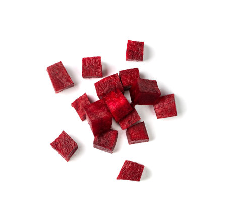 Beetroot cubes isolated. Diced red beet pile, beet root pieces, chopped beetroot on white background top viewの写真素材