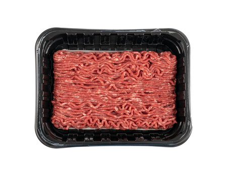 Minced beef meat in plastic container isolated. Ground fresh buffalo meat fillet, uncooked red...