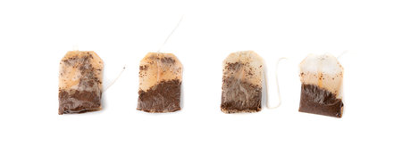 Used teabag isolated. Old wet tea bag, biodegradable garbage, eco bio used teabag on white backgroundの写真素材