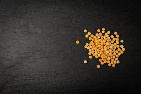 Dry Yellow Peas on Black Background, Whole Pea Pile, Raw Legume, Protein Source, Healthy Vegan Food, Scattered Dry Yellow Peas on White Backgroundの写真素材