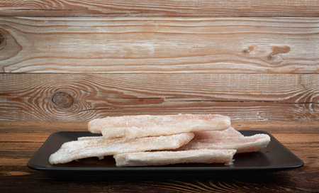 Frozen Fish on Black Isolated, White Cod Fillet, Iced Hake Filet, Frozen Pollock Meat on White...