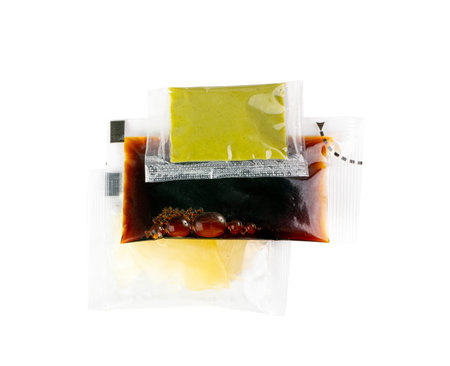 Sushi Sauces Set Isolated with Wasabi Sauce, Pickled Ginger, Soy Souse Teriyaki in Square Plastic Bags, One-Time Portions in Transparent Sachets on White Background Top View, Clipping Pathの写真素材
