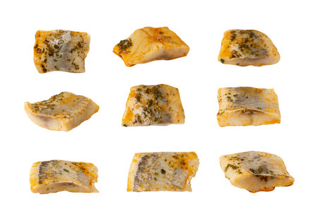 Salted Herring Fillet Pieces Isolated, Raw Pickled Fish Meat with Herbs and Spices, Marinated...