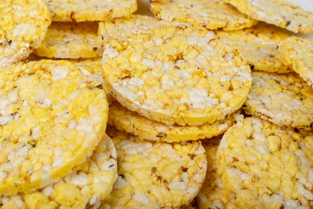 Puffed Corn Cake Texture Background. Corn Diet Bread with Fragrant Herbs and Spices, Waffle with...