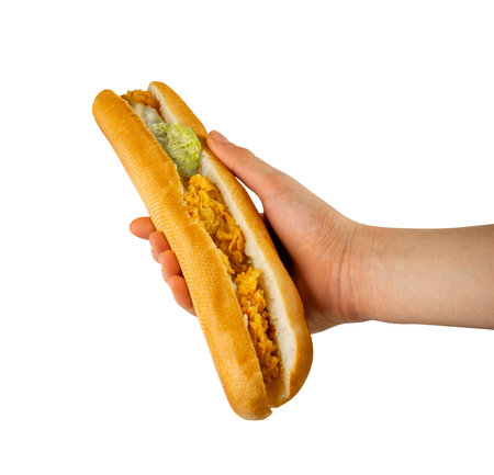 French Baguette Sandwich in Hand Isolated, Long Bread Loaf with Chicken Nuggets, Lettuce, Cucumbers on White Background, Clipping Pathの写真素材
