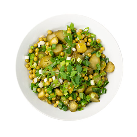 Pickled Gherkins Salad in White Bowl. Chopped Pickled Cucumbers, Canned Green Peas, Green Onions Salat Isolated on White Background Top Viewの写真素材