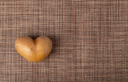 Potato Heart Top View with Copy Space, Heart Shape Potato, Love Vegetable, Valentine Day Symbolの写真素材