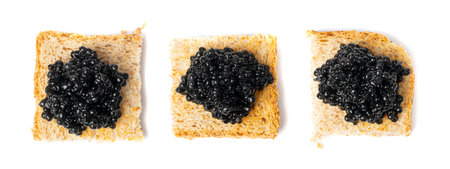 Black Caviar on Bread Isolated, Sturgeon, Sevruga, Beluga Caviar, Luxury Seafood, Expensive Gourmet Delicatessen, Black Caviar on White Backgroundの写真素材